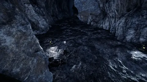 A blueprint lying on the dark rock floor of a cave, game screenshot